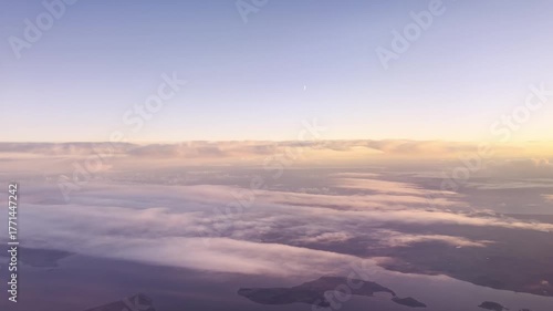 Cinematic View Of Colorful Clouds At Sunset, With The Moon Rising Above