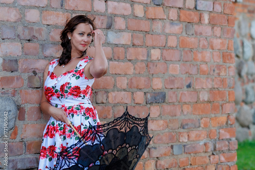 Woman in Floral Dress with Lace Parasol Outdoors