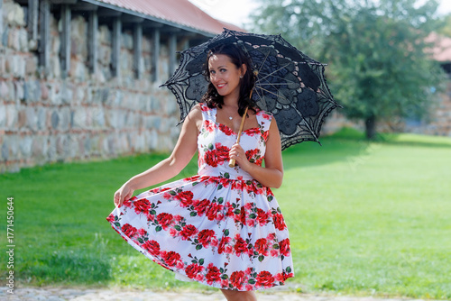 Woman in Floral Dress with Lace Parasol Outdoors