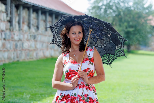 Woman in Floral Dress with Lace Parasol Outdoors