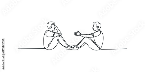 Two individuals sitting facing each other in conversation