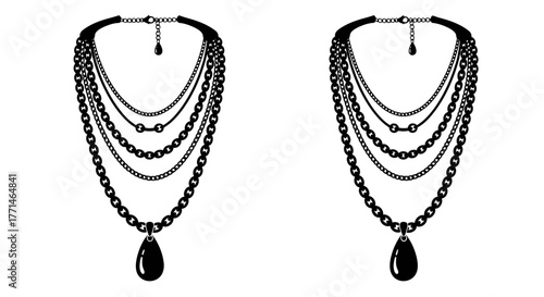 Elegant black multilayered chain necklaces with teardrop pendants displayed