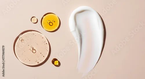 Obraz Close up of cosmetic textures with oil droplets and a creamy swirl on a neutral background
