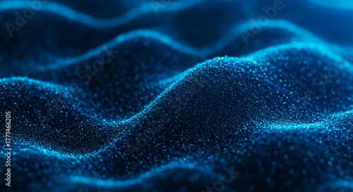 Abstract blue particle waves forming a dynamic, flowing surface