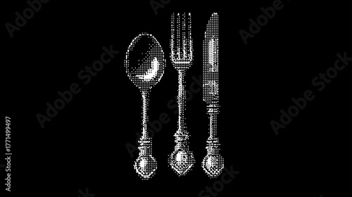 Elegant vintage ornate silverware set: classic spoon, fork, and knife dining utensils on a dark background