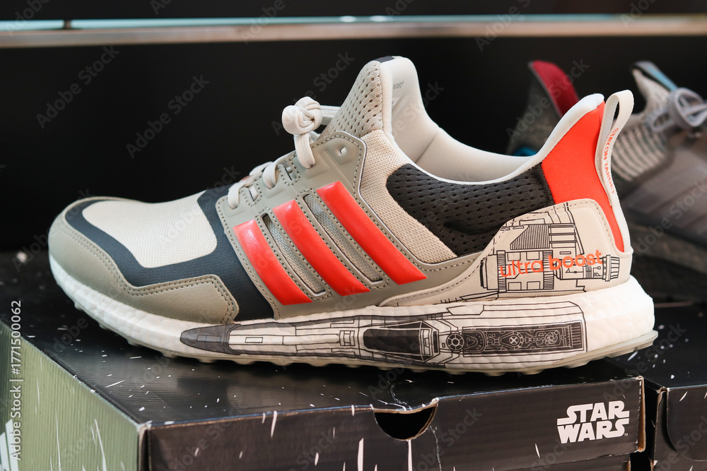 Naklejka premium TOKYO, JAPAN - June 17, 2022: Star Wars adidas sneakers on display in a pop-up Star Wars store, promoting the new TV series, in Tokyu Plaza shopping center.