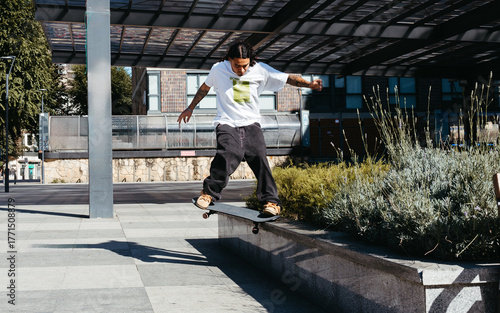 Skater Grinding a Ledge in Urban Skate Spot