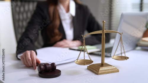 Asian lawyer working in law firm, Conceptualizing justice advice, Focuses on the judge's scales and gavel.