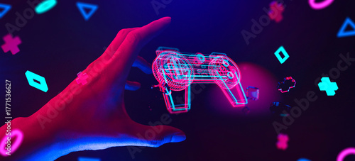 gamer hand touching and interactive to holographic of gaming joystick controller, game and esports technology