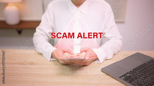 Scam alert warning message on smartphone screen.