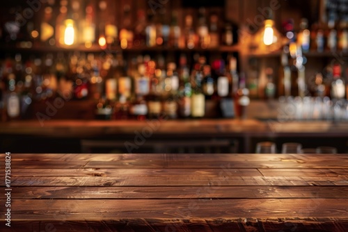 Wooden bar counter with blurred bottles in background