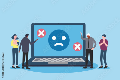 Diverse group of people reacting to a laptop screen displaying a sad face and red crosses indicating failure or disapproval