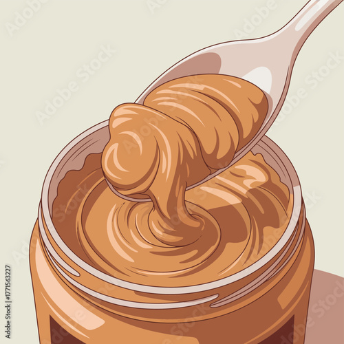 Creamy peanut butter swirl on spoon above open jar