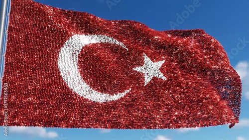 Vibrant Turkish flag composed of tiny particles waving proudly against a clear blue sky