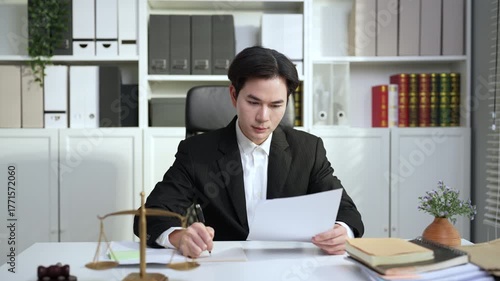 Asian lawyer working in law firm, Conceptualizing justice advice.