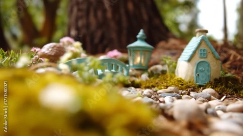 Miniature garden scene with bridge house and lantern outdoor setting