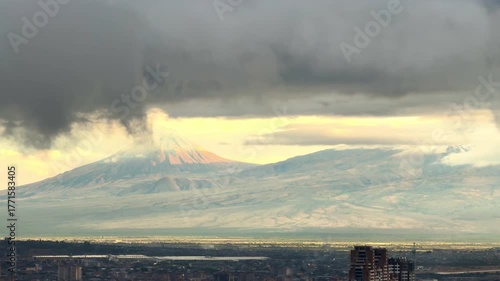 Mount Ararat in cloudy weather during the rain, view of the mountains with the city in the background, beautiful view of the city of Yerevan. High 4k quality