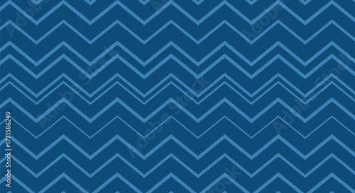 A repeating zig-zag pattern in shades of blue. Lines form a textured background