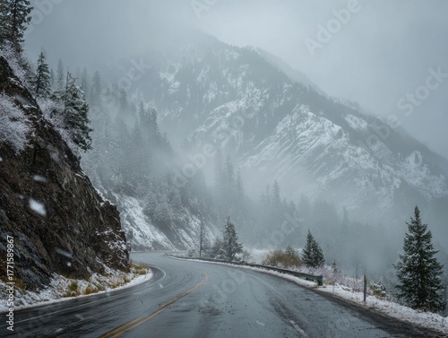 Winding Mountain Road Winter Landscape Evergreen Forest Snow-Covered Peaks Foggy Weather Conditions Seasonal Travel Route Scenery