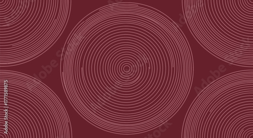 A burgundy background features multiple nested circles and quarter-circle arrangements