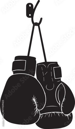Classic black boxing gloves hanging by laces ready for a fight or training session