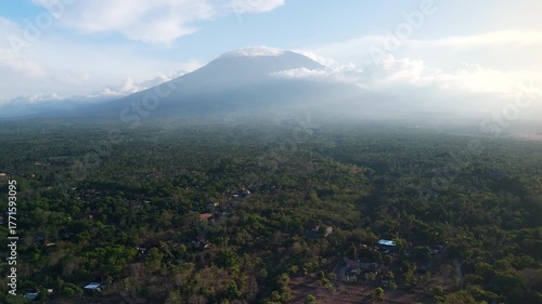 Mountain landscape with volcano and cloudy sky in Bali. Drone view