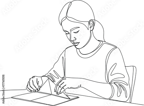 Focused young woman in minimalist line art folding origami paper craft, concentrating on creative hobby at desk