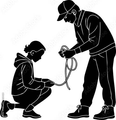 Silhouette of Adult and Child Preparing Rope – Teaching and Outdoor Activity Scene in Black and White