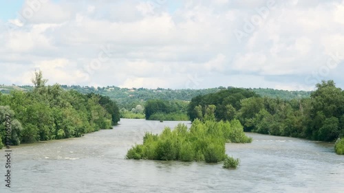 View of the Garonne river south of Toulouse Southern France in summer under a blue sky with clouds
