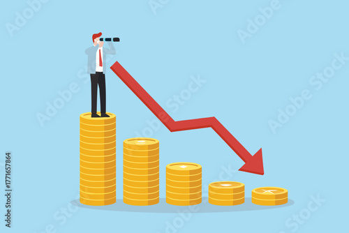 Businessman with telescope on stack of coins looking at downward trending graph representing financial loss