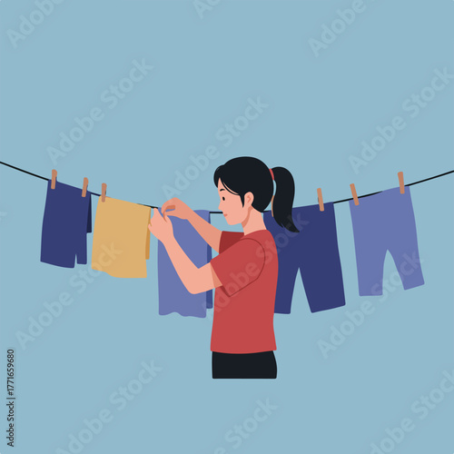 A woman hanging clothes on a clothesline with wooden pins. Background is plain light blue