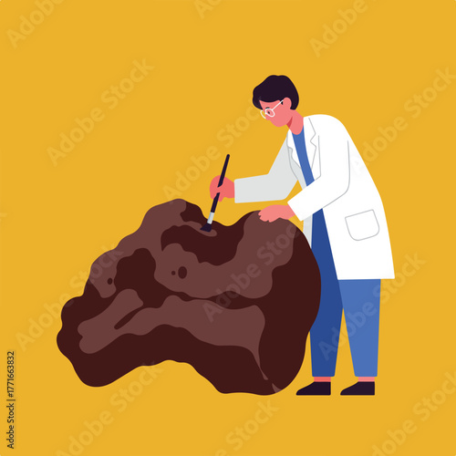 A person in a lab coat and glasses uses a brush to examine a large rock against a yellow background