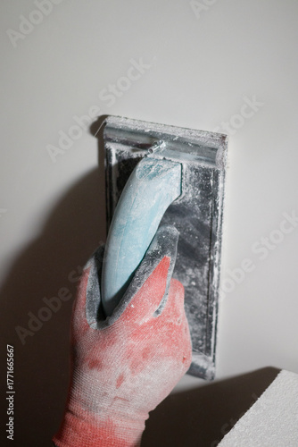 Finishing grout of the wall for painting.