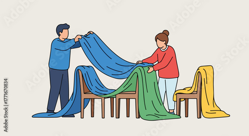 People draping colorful fabrics over chairs