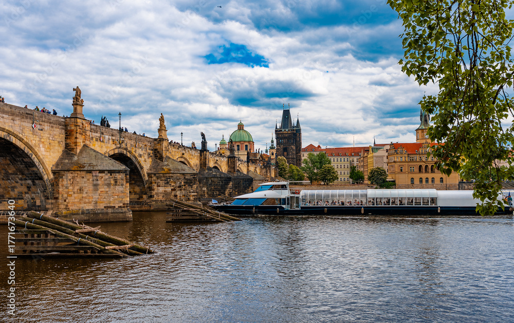 Obraz premium Tourist Ship on Vltava Near Prague Charles Bridge.