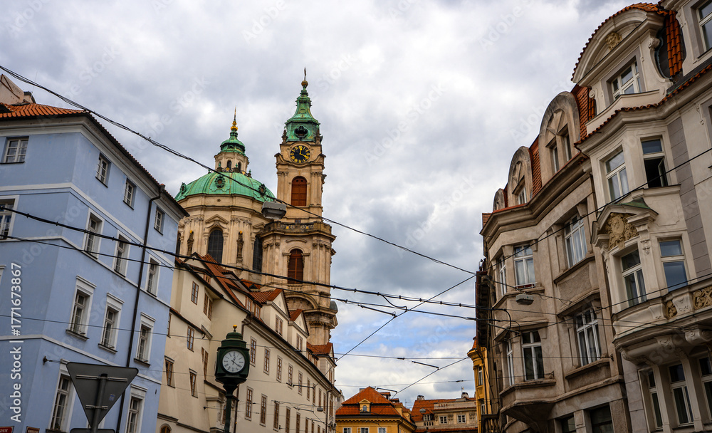 Fototapeta premium Saint Nicholas Church Tower Dominates Prague Lesser Town.
