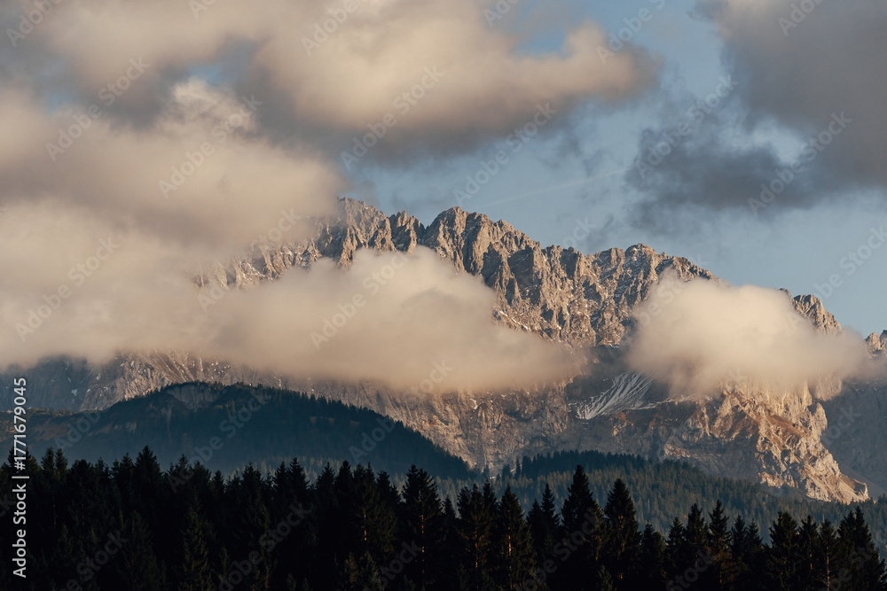 Fototapeta premium Mountain peaks glowing in the sunrise