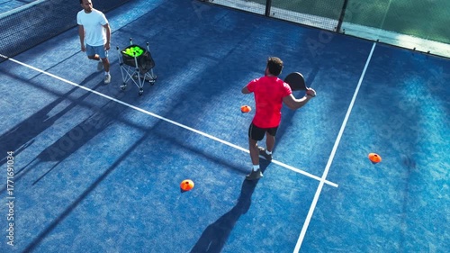 Training, padel and coaching with man on court for footwork drills, learning and tournament challenge. Agility lesson, tennis player and contest guide with above of person on turf for sports club