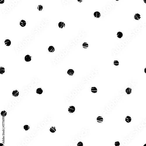 Seamless vector pattern with irregular placed small black textured dots on white background for fashion and paper crafts