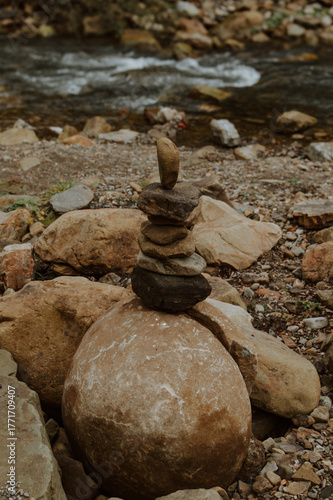 Balancing stone tower by mountain river, concept of relaxation and meditation