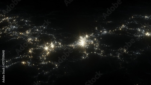 Nighttime satellite view of illuminated urban areas and city lights across a region