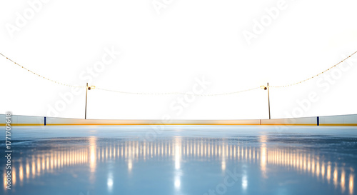Ice skating rink at night with illuminated surface and ropes  