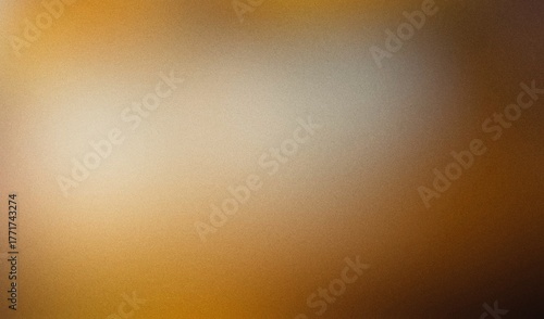Abstract grainy background with warm brown and gold gradient.