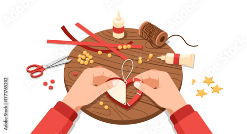 Crafting heart decoration with paper and string on wooden table