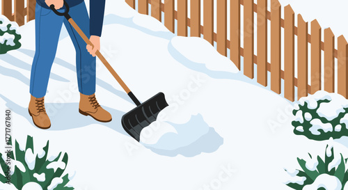 Man shoveling snow in winter backyard scene with wooden fence and bushes