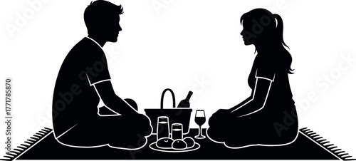 Silhouette of a couple sitting opposite each other at a table with drinks and food