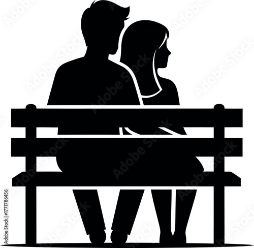 Silhouette of a romantic couple sitting closely together on a park bench enjoying a quiet moment