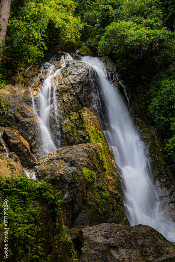 Fototapeta premium A gorgeous waterfall captured in long exposure, Punjaban Waterfall, national park, Ranong, Thailand.