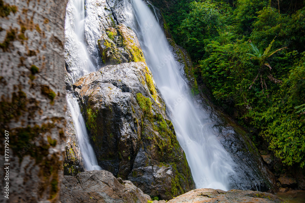 Obraz premium A gorgeous waterfall captured in long exposure, Punjaban Waterfall, national park, Ranong, Thailand.