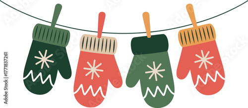 Four colorful mittens hang on a line, decorated with snowflake patterns.